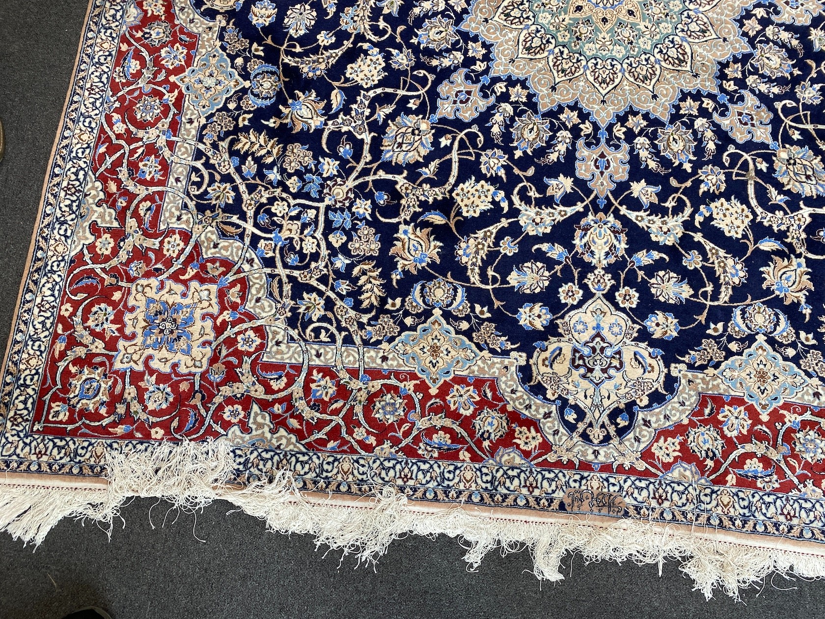 A North West Persian blue ground part silk rug, 220 x 217cm together with a similar smaller red ground rug